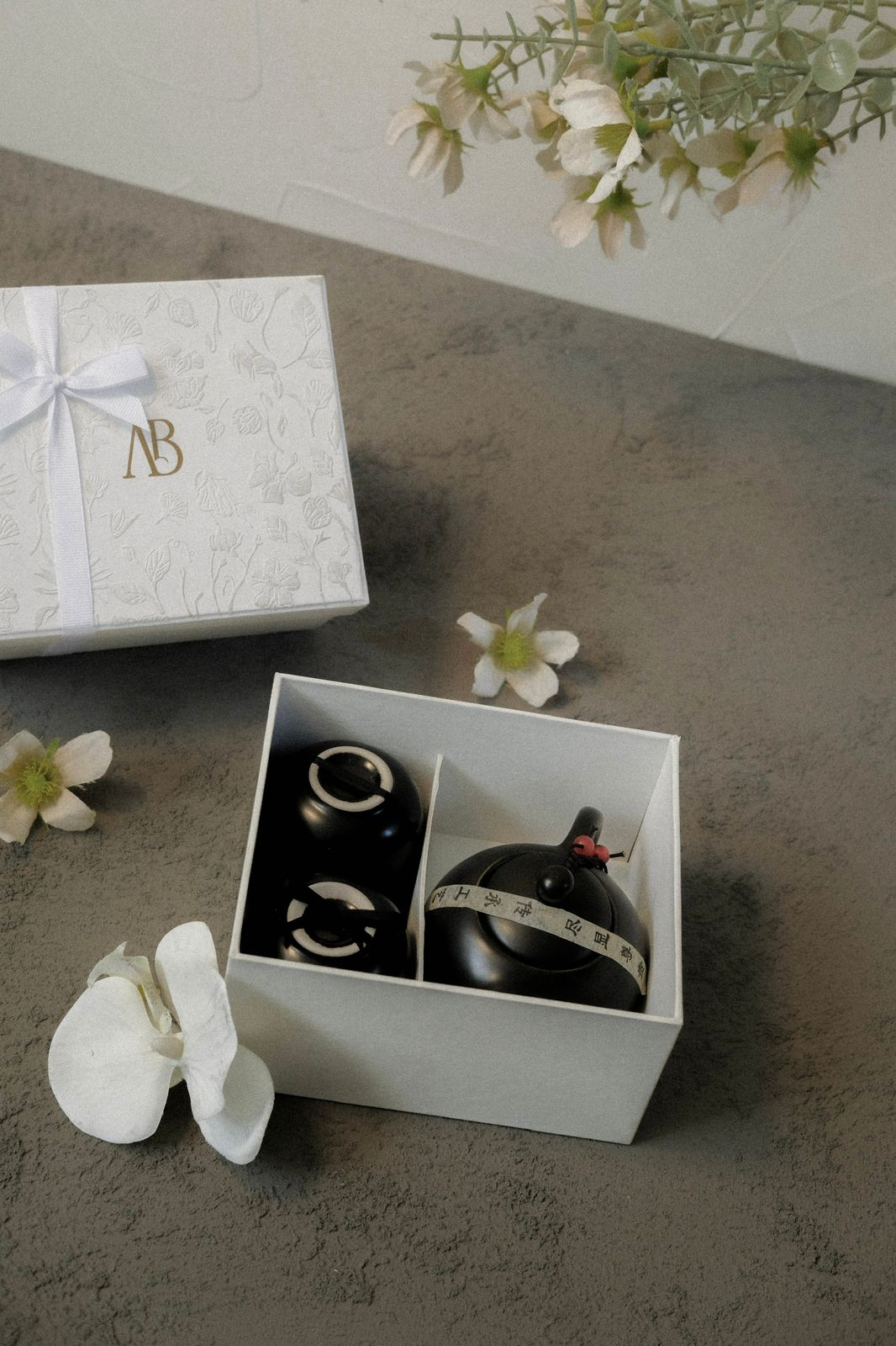 Ceramic tea set favor with embossed monogrammed gift box