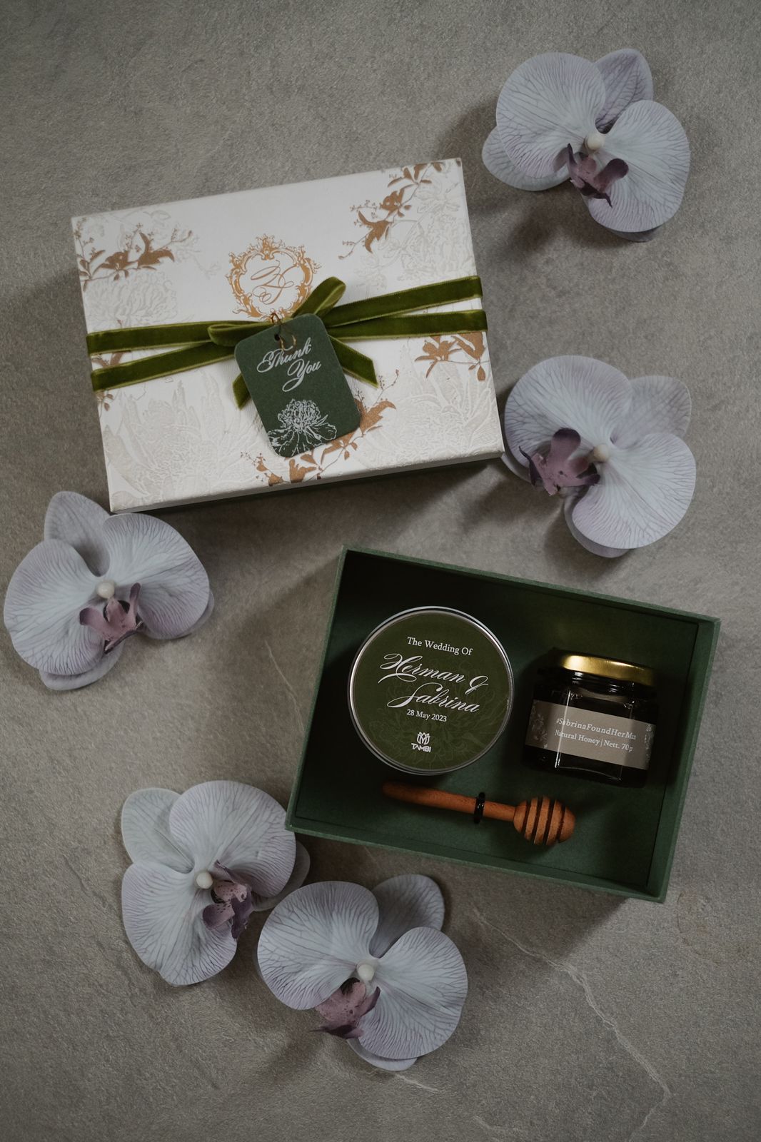 Honey jar and wooden dipper favor set in an olive green keepsake box
