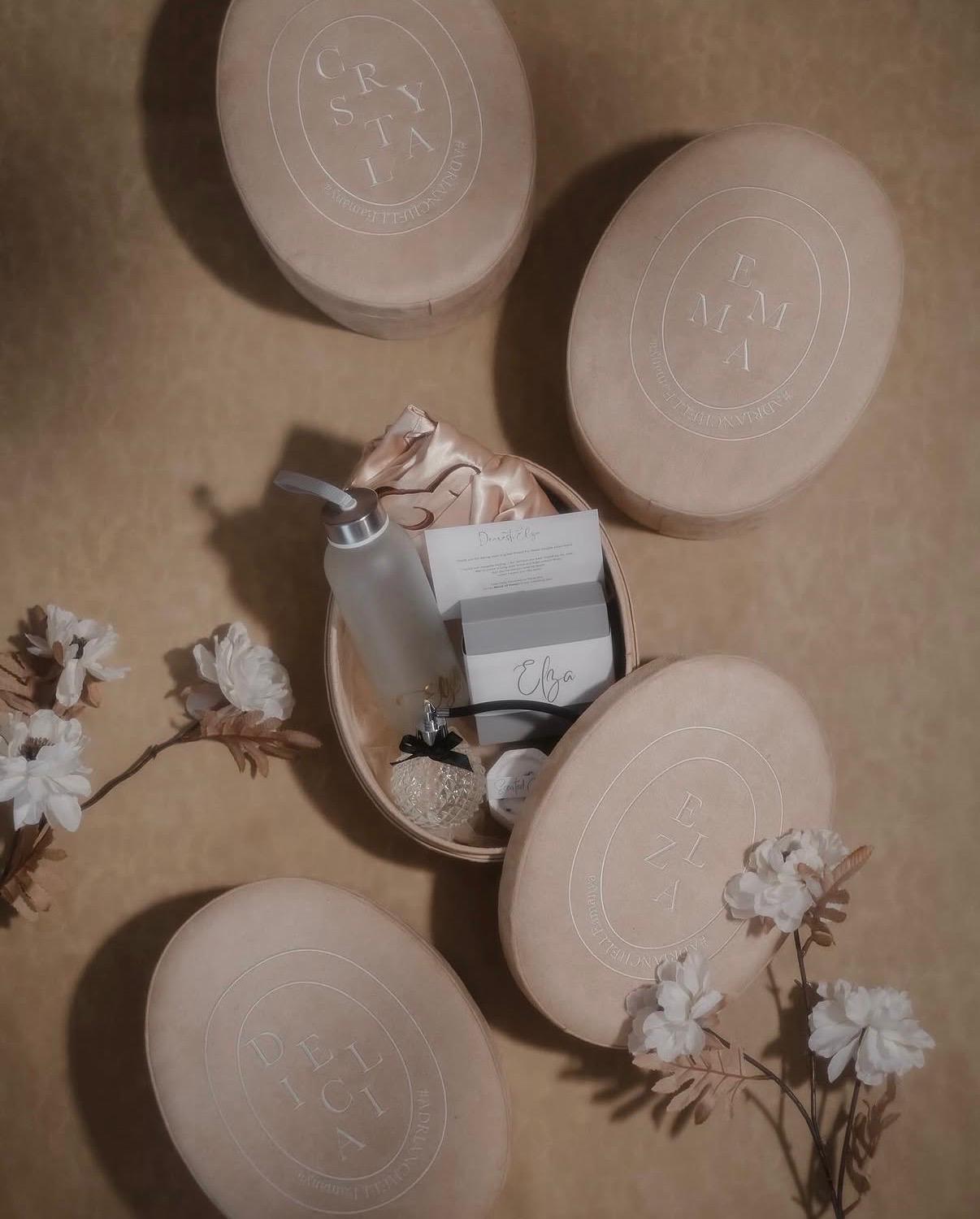 Custom bridesmaid thank-you gift set with monogrammed oval keepsake boxes
