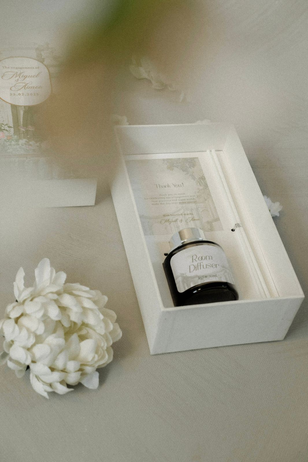 Room diffuser bottle in a white gift box with thank you card and jasmine flower